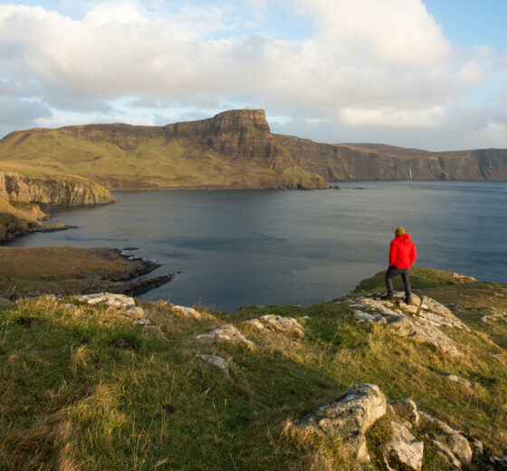 Hiker walking on the isle of Skye, Hebrides, walking holidays in Scotland