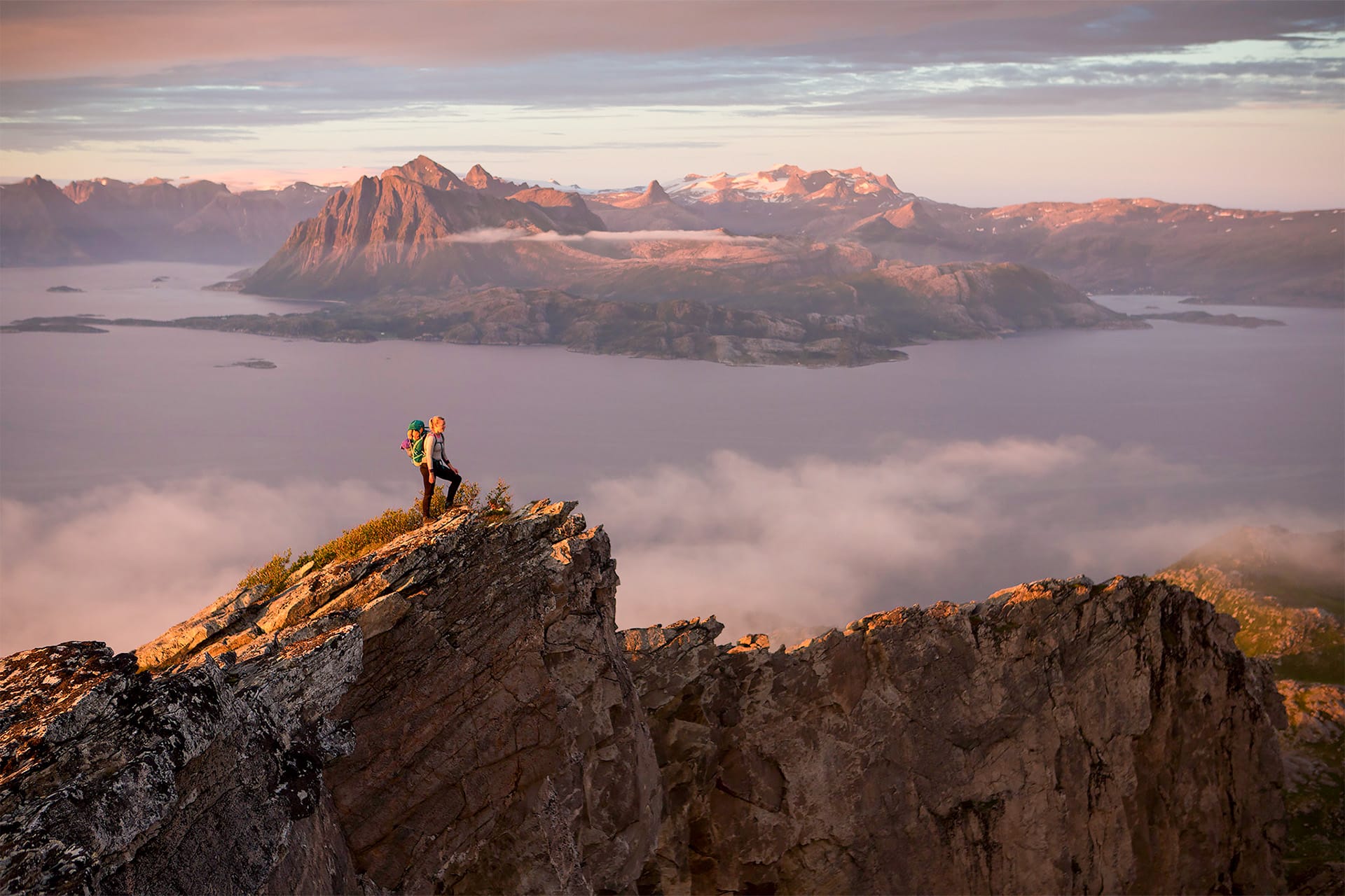 Humla guest hiking in the lofoten islands Norway top of mountain
