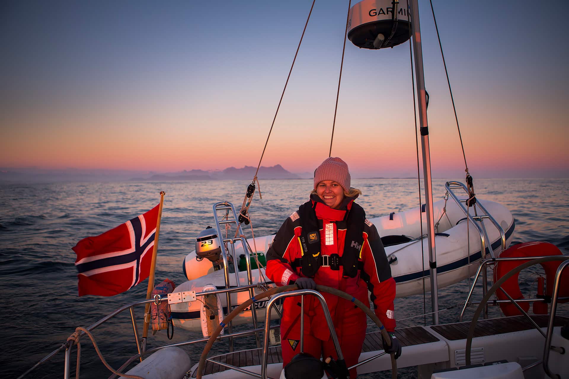 Humla guest sunset sailing in Northern Norway winter female solo sailor