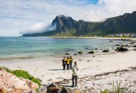 Humla guests on beach in Lofoten Islands Norway