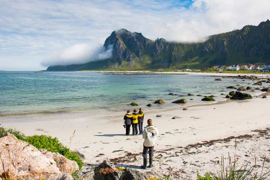Humla guests on beach in Lofoten Islands Norway