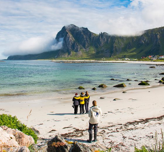 Humla guests on beach in Lofoten Islands Norway