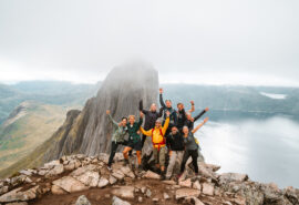 Humla hike and sail guests at top of mountain, Lofoten Islands, Norway
