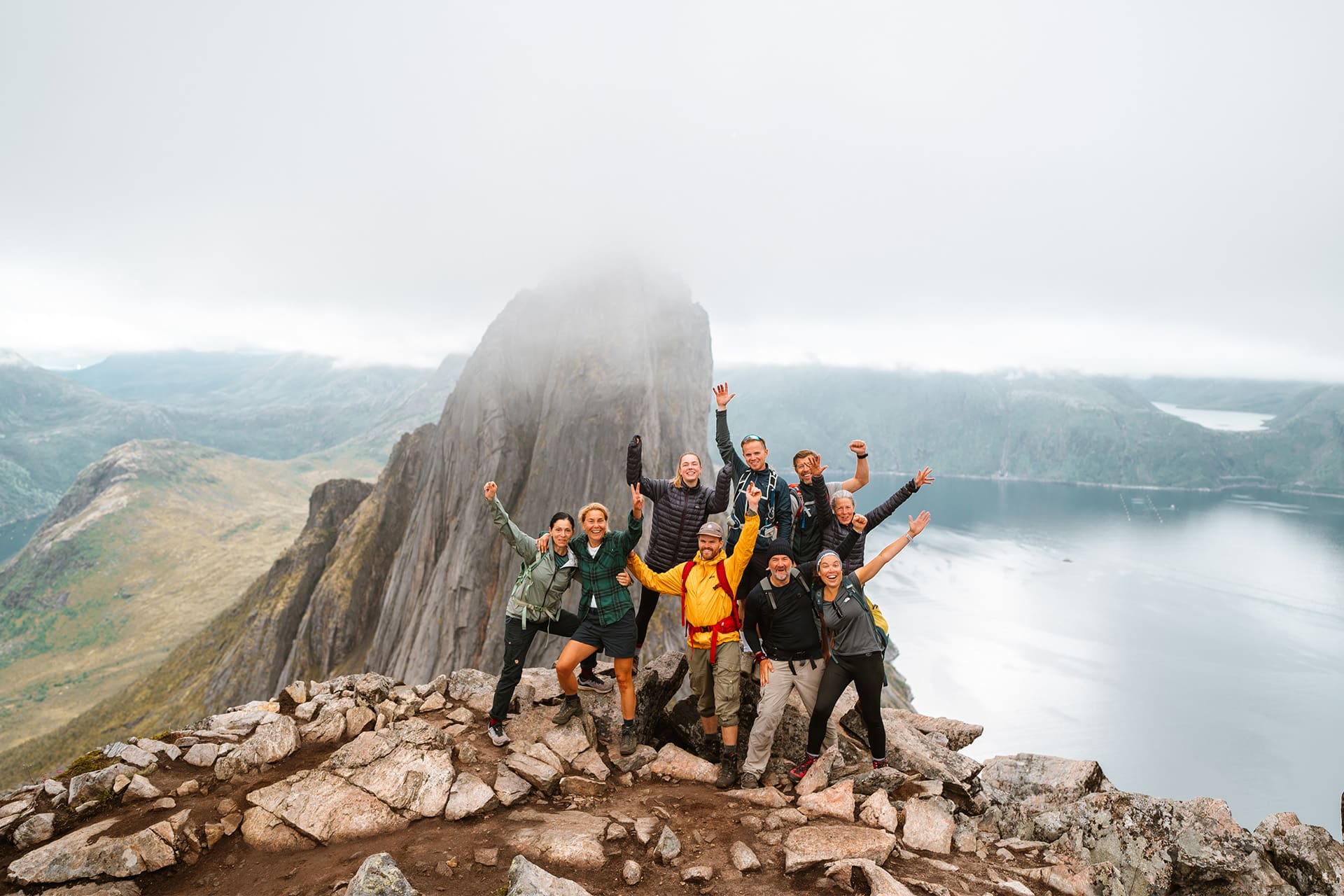 Humla hike and sail guests at top of mountain, Lofoten Islands, Norway