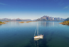Humla yacht anchored in the Lofoten Islands, Norway on a sunny day