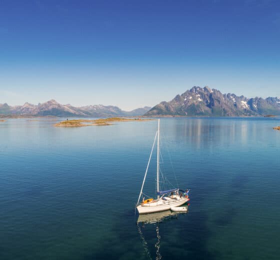 Humla yacht anchored in the Lofoten Islands, Norway on a sunny day