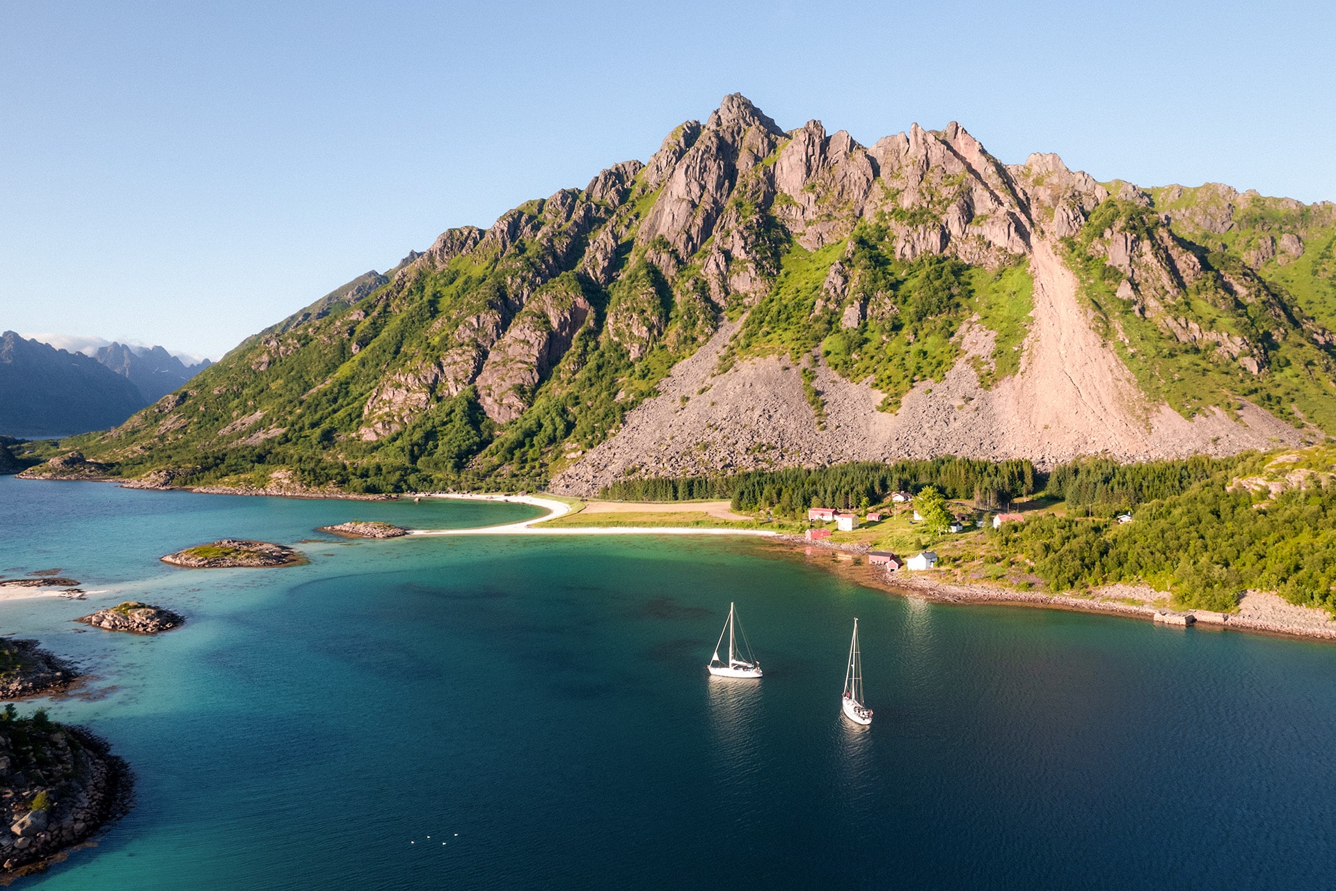 Humla yachts anchored in Lofoten islands Norway sailing in tandem