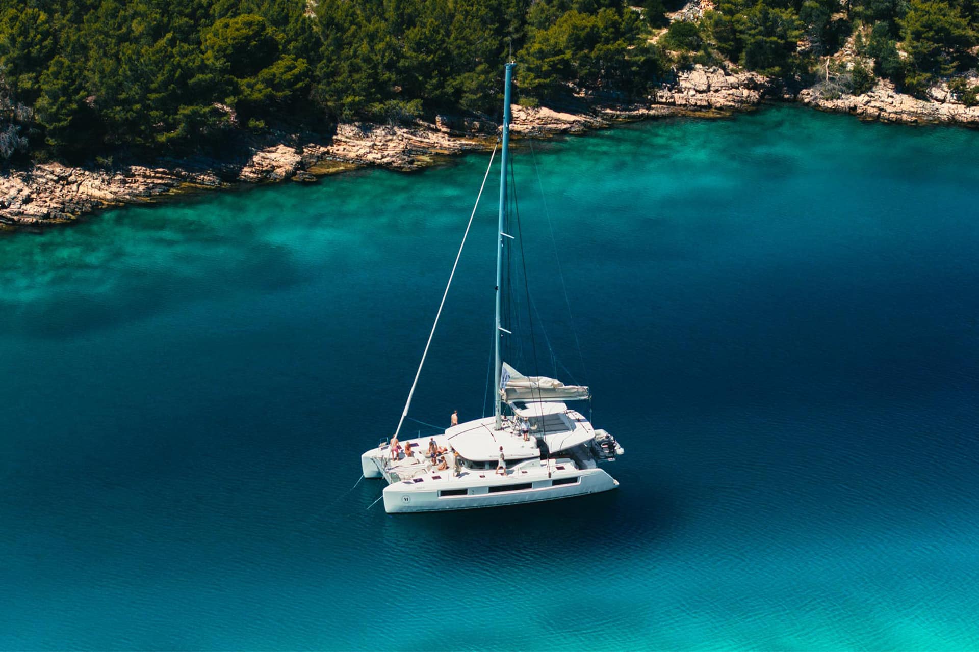 Ingrid More catamaran anchored in turquoise cover