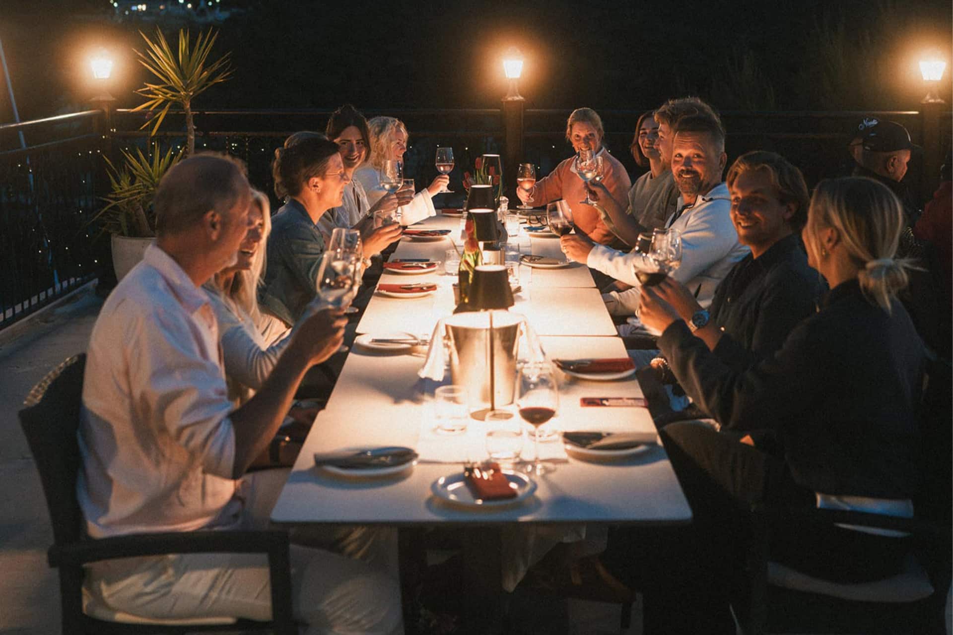 Ingrid More catamaran guests enjoying dinner local restaurant