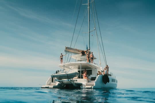 Ingrid More catamaran guests onboard anchored relaxing