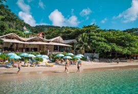 Ingrid More catamaran guests relaxing on beach in bequia, Caribbean Islands