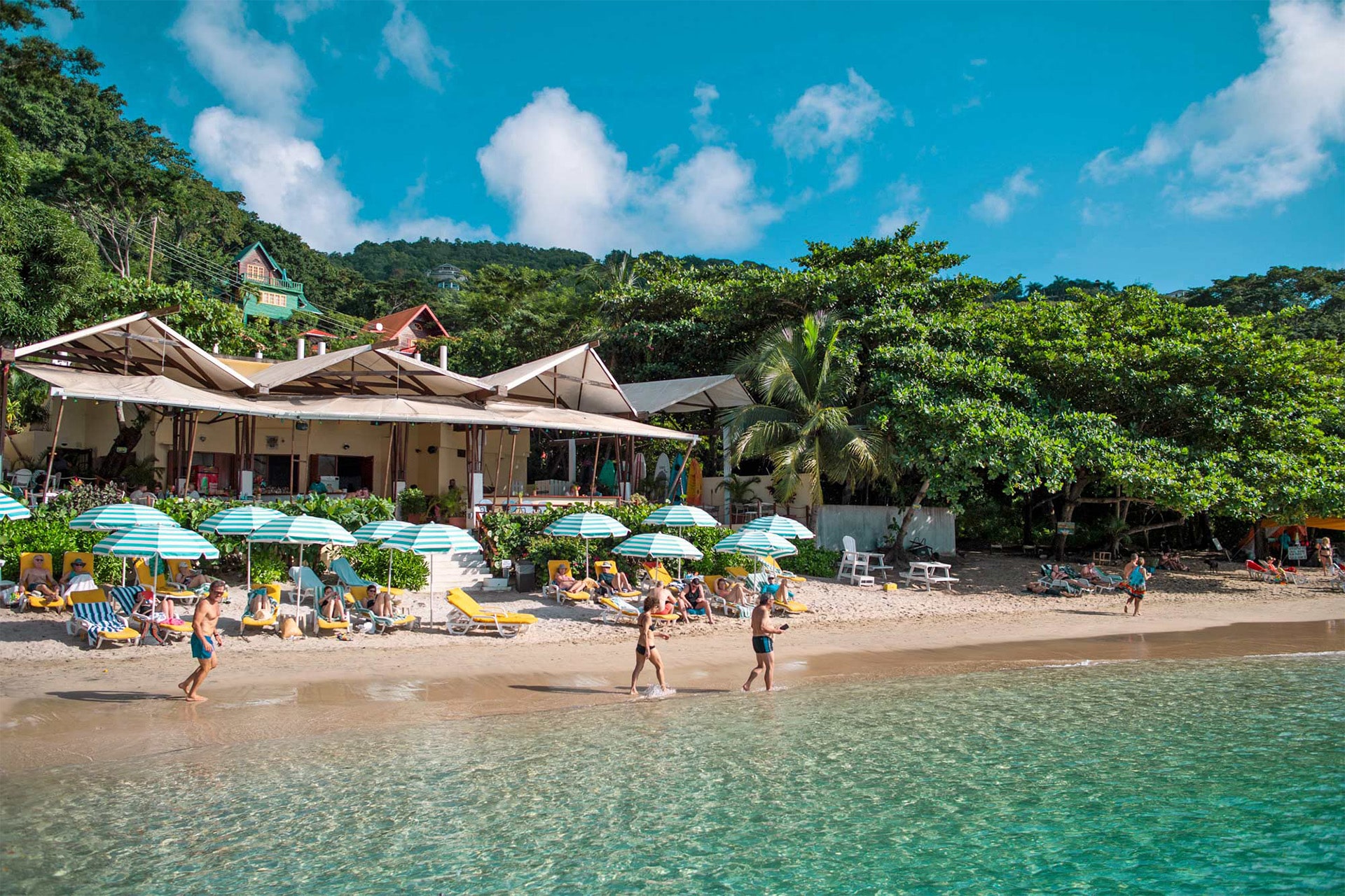 Ingrid More catamaran guests relaxing on beach in bequia, Caribbean Islands