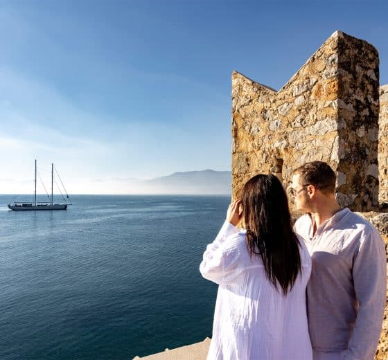 Kairos anchored in Mediterranean with guests ashore