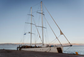 Kairos anchored in marina at dusk