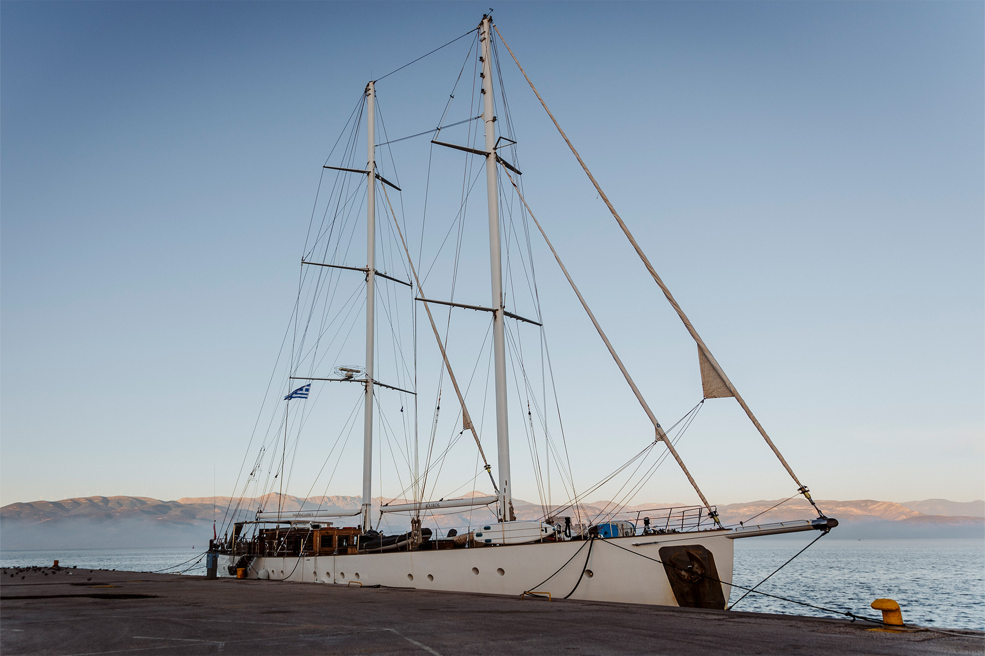 Kairos anchored in marina at dusk