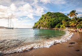 Kairos anchored with view of tropical Caribbean beach