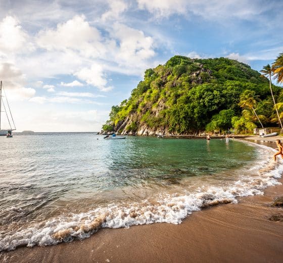 Kairos anchored with view of tropical Caribbean beach