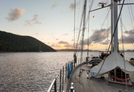 Kairos yacht on deck un BVIs looking at sunset British Virgin Islands