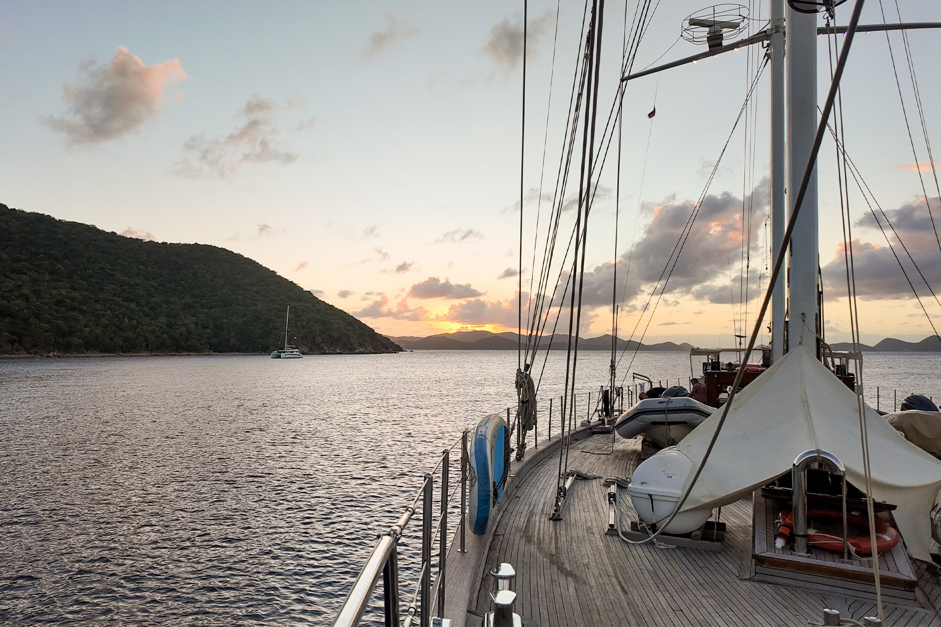 Kairos yacht on deck un BVIs looking at sunset British Virgin Islands