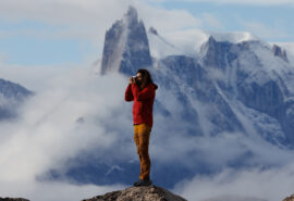 Linden guest standing on mountain Arctic Greenland views