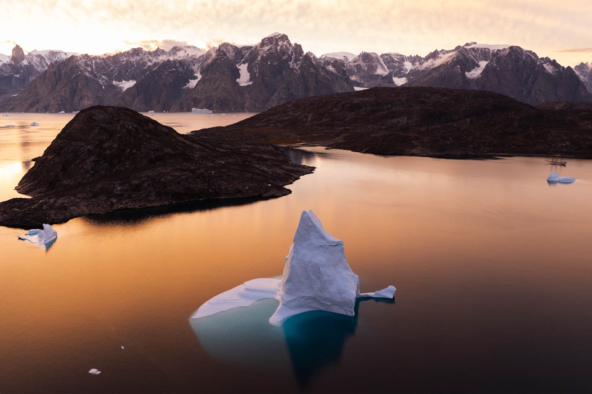 Linden tall ship anchored at dusk in Arctic Circle Greenland at sunset