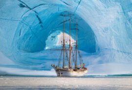 Linden tall ship anchored in Greenland beneath Glacier Arctic Circle