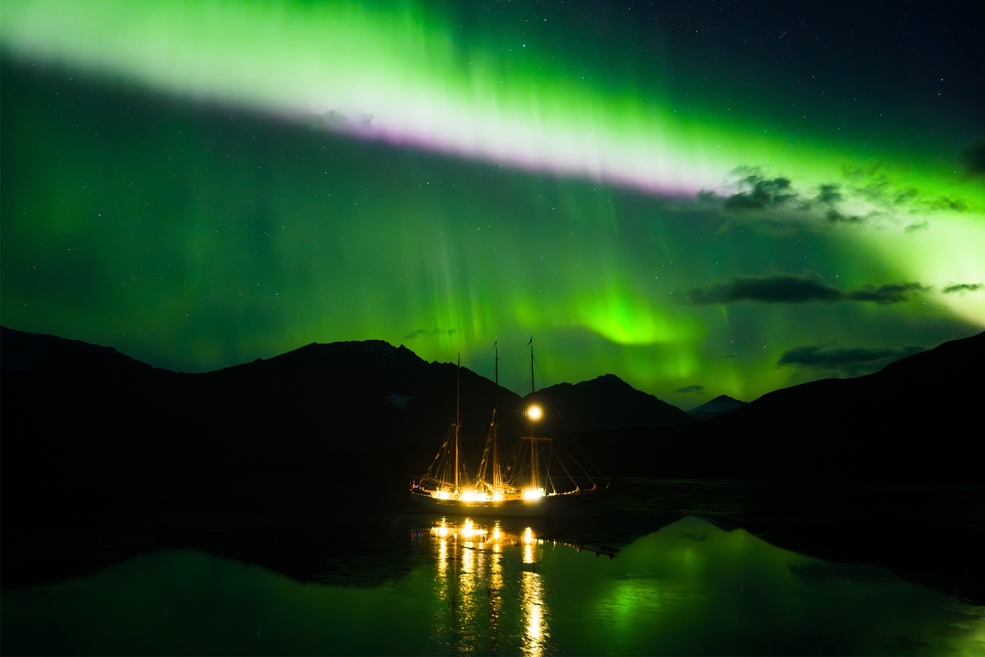 Linden tall ship anchored under Northern lights in the Arctic Circle Greenland