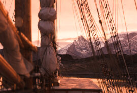 Linden view of Arctic Greenland Mountains on deck at sunset