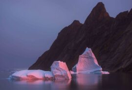 Linden view of Arctic icebergs in Greenland at dusk