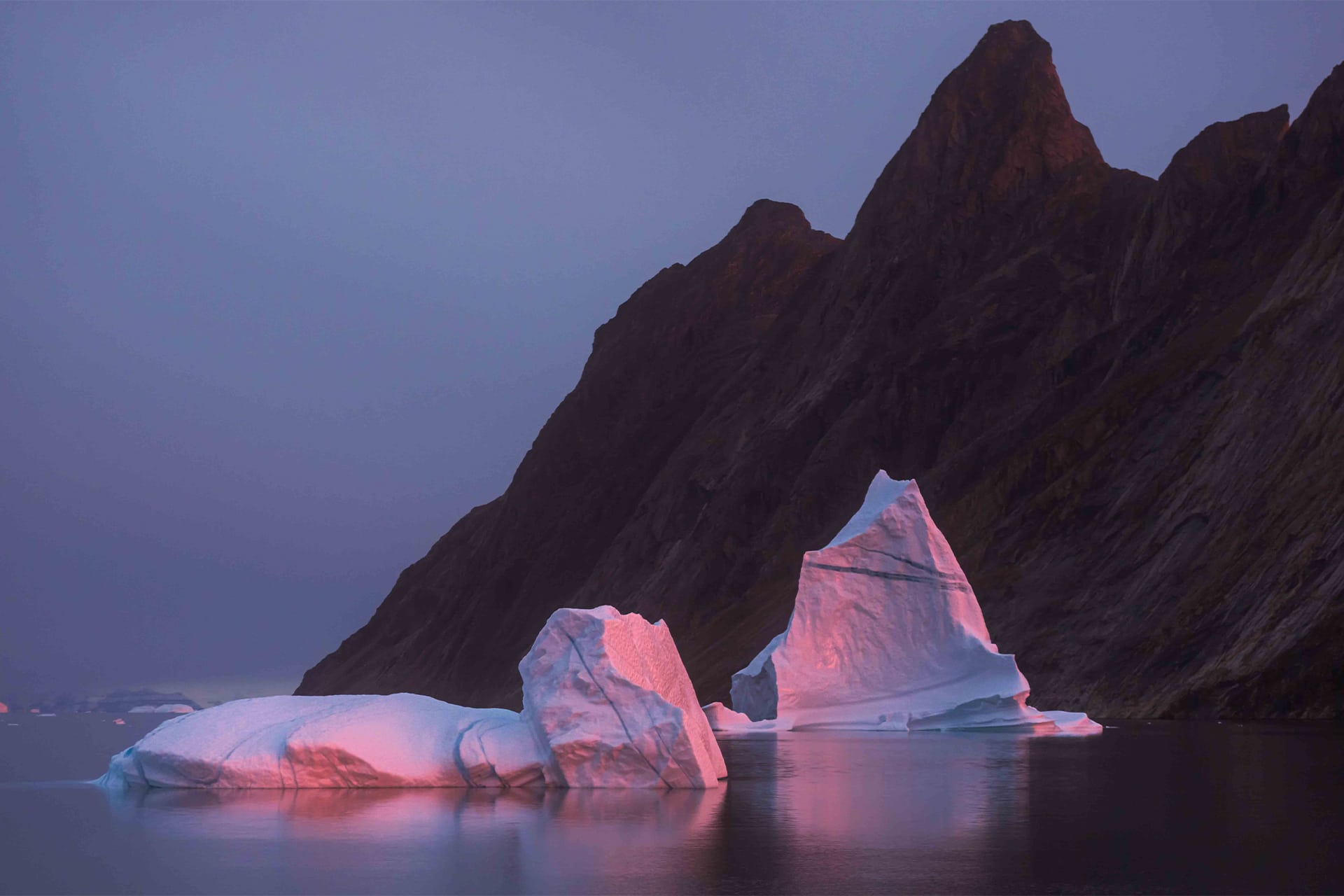 Linden view of Arctic icebergs in Greenland at dusk
