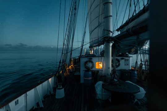 Night Sailing on deck of Blue Clipper