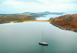 Noonmark VI adventure yacht anchored at Twin Beaches, Isle of Gigha, Hebrides, Scotland