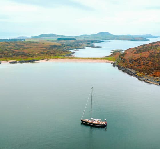 Noonmark VI adventure yacht anchored at Twin Beaches, Isle of Gigha, Hebrides, Scotland