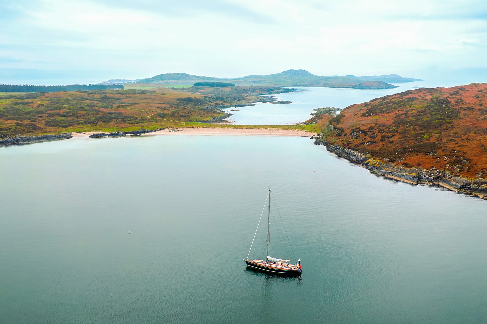 Noonmark VI adventure yacht anchored at Twin Beaches, Isle of Gigha, Hebrides, Scotland