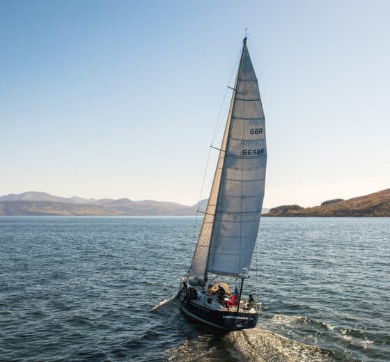 Noonmark VI adventure yacht sailing from stern Scotland