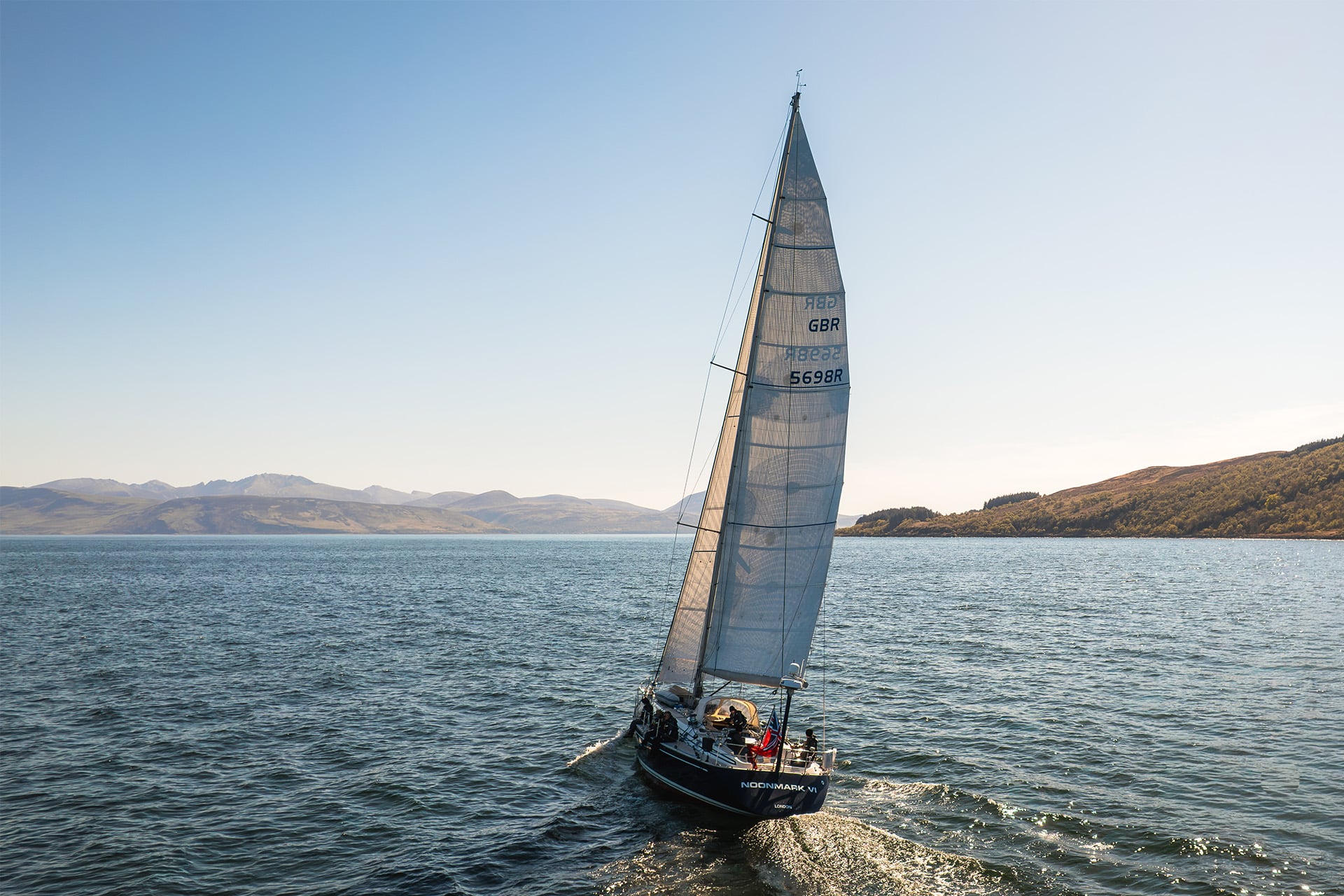 Noonmark VI adventure yacht sailing from stern Scotland