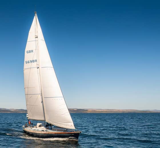 Noonmark VI adventure yacht sailing in full sail Hebrides, Scotland