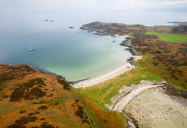 Noonmark VI yacht anchored aerial view at Twin beaches, Gigha, Kintyre, Hebrides Scotland