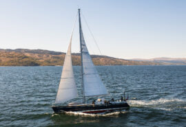 Noonmark VI yacht sailing underway from side in Hebrides, Scotland