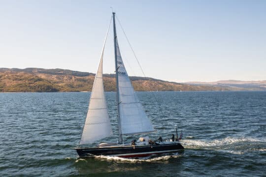 Noonmark VI yacht sailing underway from side in Hebrides, Scotland