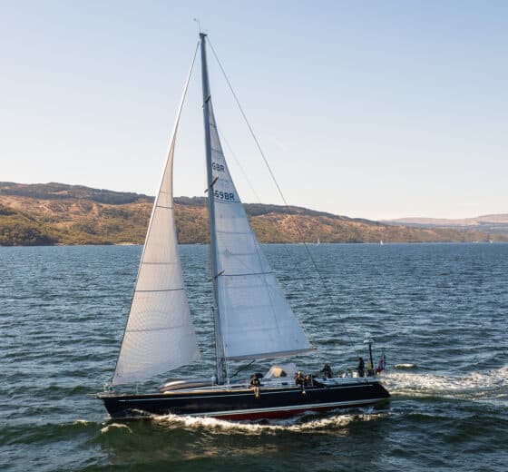 Noonmark VI yacht sailing underway from side in Hebrides, Scotland