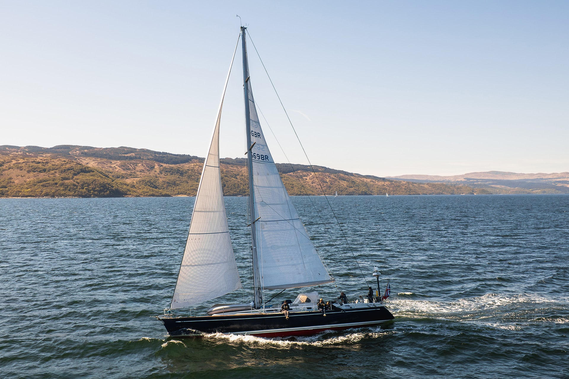 Noonmark VI yacht sailing underway from side in Hebrides, Scotland