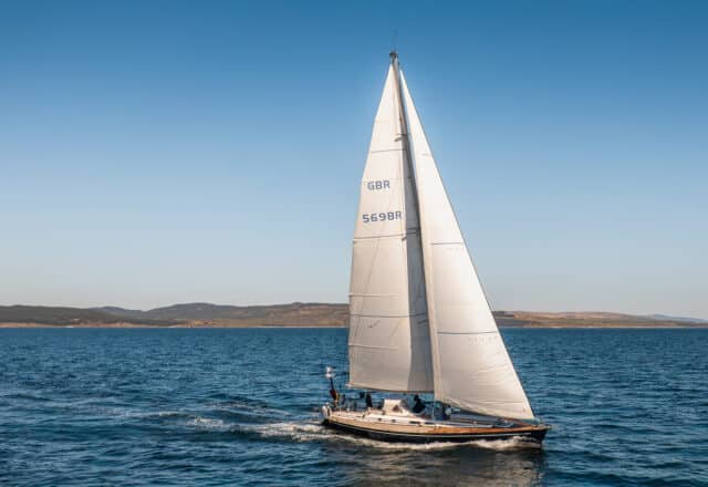 Noonmark VI yacht underway full sail Hebrides, Scotland