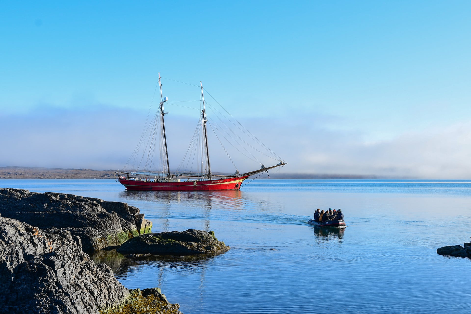 Noorderlicht guests going ashore on tender sunny day