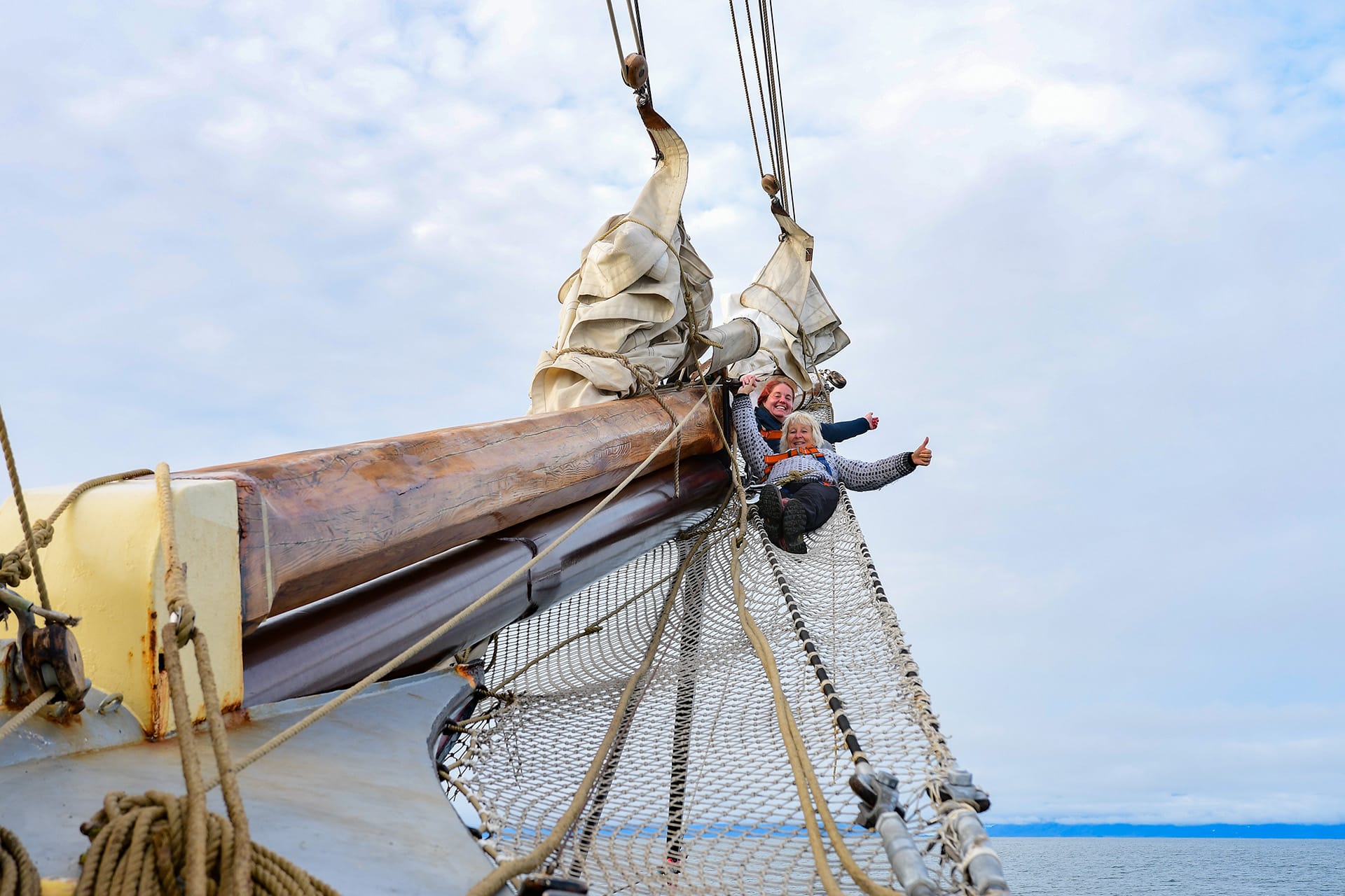 File name: Noorderlicht-guests-on-bowsprit-of-tall-ship.jpg