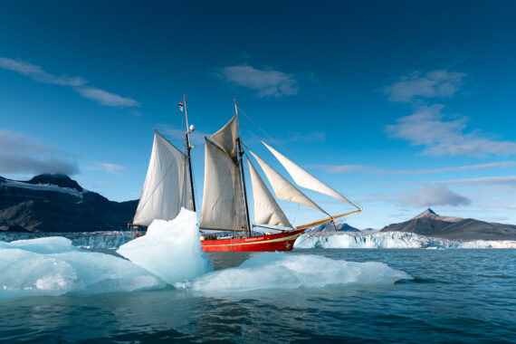 Noorderlicht tall ship sailing with floating ice Svalbard summer