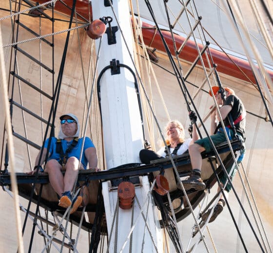 Oosterschelde guests onboard climbing rigging on deck