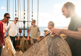 Oosterschelde guests onboard tidying sails