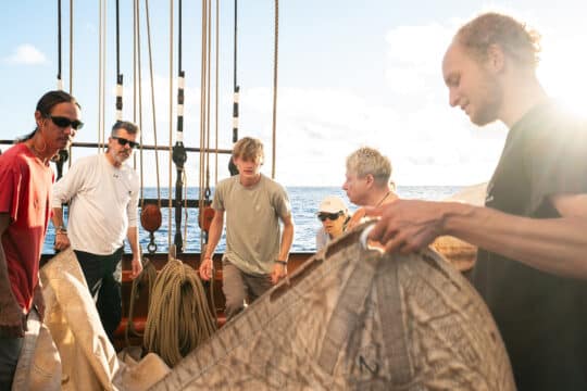 Oosterschelde guests onboard tidying sails