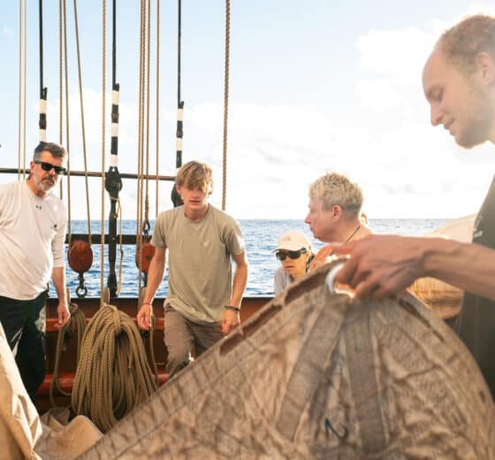 Oosterschelde guests onboard tidying sails